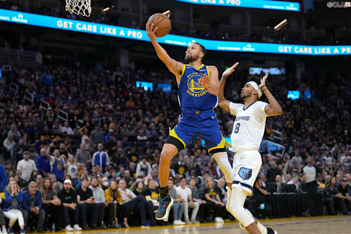 Golden State Warriors guard Stephen Curry (30) drives to the basket past Memphis Grizzlies guard Ziaire Williams (8) during the first half of Game 6 of an NBA basketball Western Conference playoff semifinal in San Francisco, Friday, May 13, 2022.